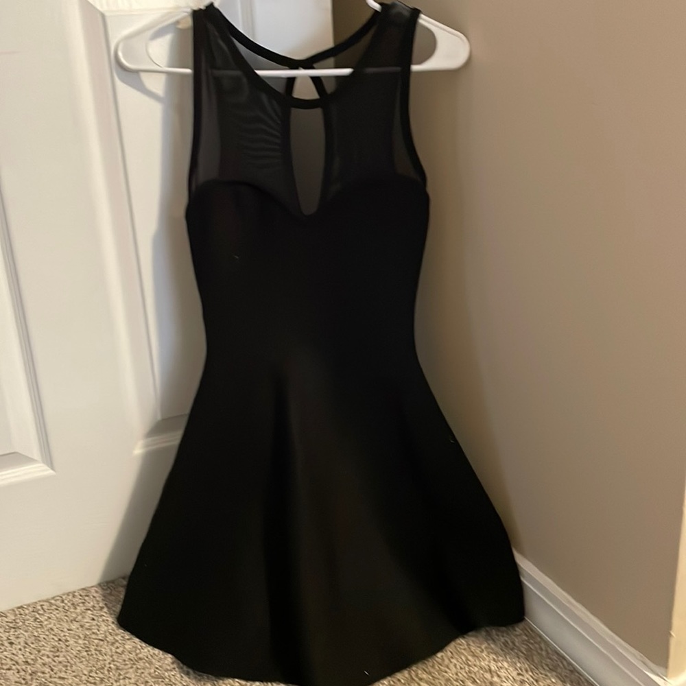 Black mini dress with mesh detailing at top